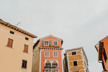 Orange buildings under the gray skies