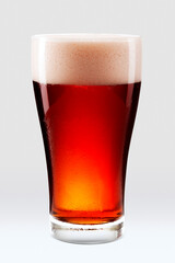 Fresh amber beer with foam in a pint