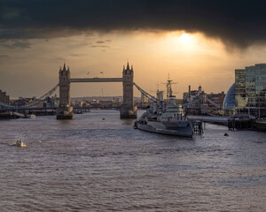 Obraz na płótnie Canvas London England, the tower bridge over Thames river under dramatic sky