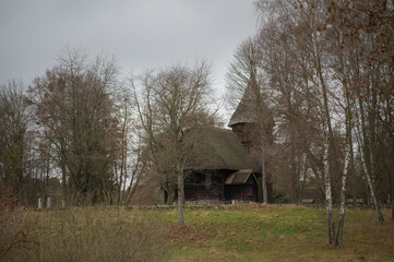 Obraz premium old wooden church in the middle of the forest