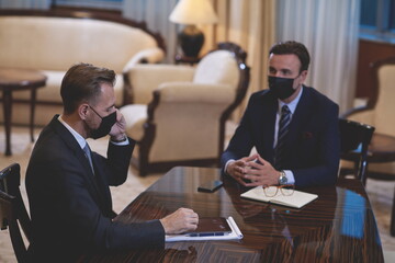 business people wearing crona virus protection face mask on meeting