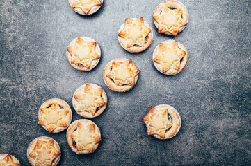 Mince pies, traditional christmas food from all butter shortcrust pastry filled with cranberries, sultanas, currants, raisins, along with festive spices, clementine juice, dash of brandy and cognac