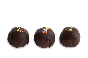 Chocolate ball cake coated with chocolate sauce, Sprinkled with colorful sugar, Isolated on white background with copy space.