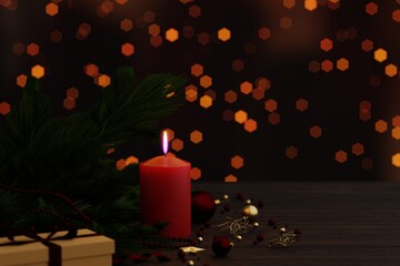 Christmas candles 3D and ornaments over dark background with lights.