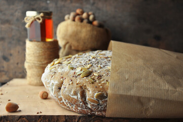 Bread, nuts in a bag, honey and twine.