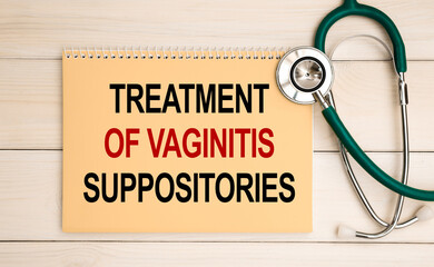 Notepad with the inscription Treatment of vaginitis suppositories and stethoscope