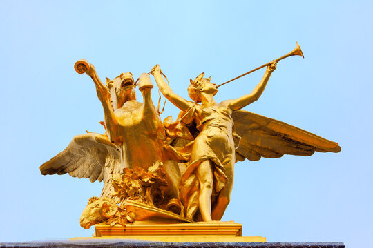 Pegasus and Fame golden sculpture . Statue on the Pont Alexandre III in Paris