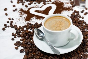 cup of espresso, heart and coffee beans conceptual photography
