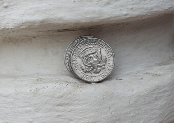 Half dollar coin on a concrete background
