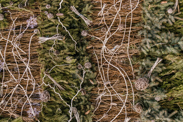 Toy snowflakes, wicker willow and spruce branches. Christmas background and decorations