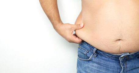 Naklejka premium Obese man holding his excess fat around his waist