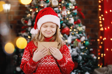 Fototapeta na wymiar Blonde girl with the Christmas letter.