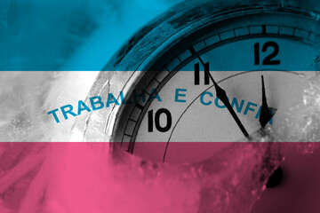 Brazil, Brazilian, Espirito Santo flag with clock close to midnight in the background. Happy New Year concept