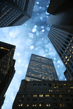 Fototapeta Beautiful winter snowfall sky seen through rising skyscrapers in downtown Manhattan, New York, NY, USA.