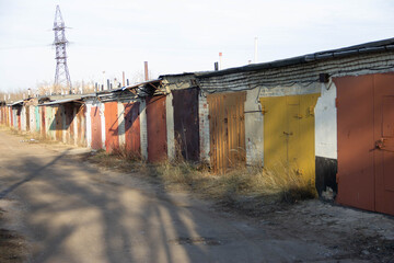 a row of garages with colorful gates