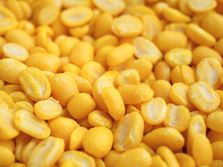 Golden yellow organic mung beans without shell, Used as wallpaper or background.