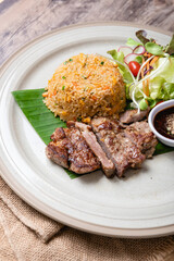 Fried Crispy Pork  On a white plate- Thai food style

