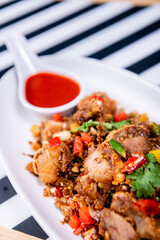 Fried Crispy Pork  On a white plate- Thai food style
