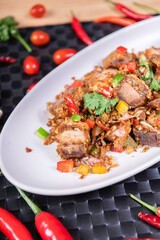 Fried Crispy Pork  On a white plate- Thai food style
