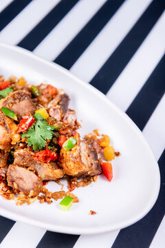 Fried Crispy Pork  On a white plate- Thai food style
