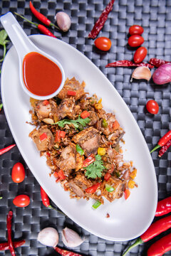 Fried Crispy Pork  On a white plate- Thai food style
