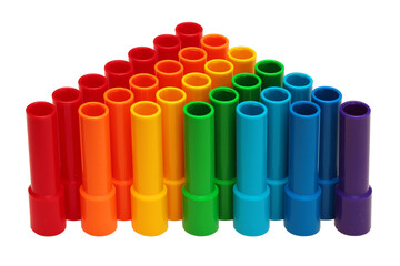 Rainbow colored plastic pipes isolated against white background