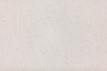 Water drops are frozen on light wall