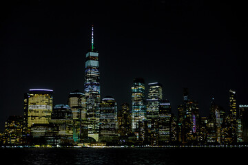 Fototapeta na wymiar New York City Manhattan skyline panorama at night over Hudson river with reflections viewed from New Jersey