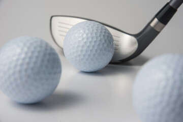 golf club and ball on white background