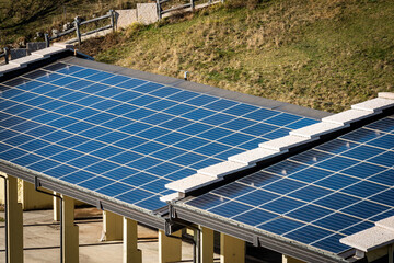 Closeup of a shed with many solar panels on the roof. Lessinia Plateau, Verona Province, Veneto,...