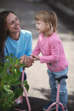 Mother with her disabled daughter, Cerebral Paralysis, Disabled children, disabled child with crutches.
