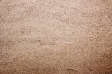 Beige colored abstract wall texture background in different shades of cream or beige