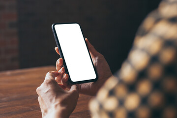 cell phone blank white screen mockup.woman hand holding texting using mobile on desk at office.background empty space for advertise.work people contact marketing business,technology