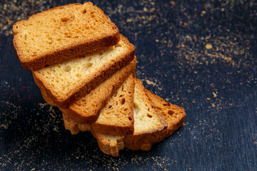 crispy rusk, cake rusk over Dark background