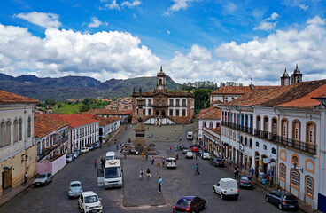 Naklejka na ściany i meble View from the central square in historical city of Ouro Preto with tourists and locals