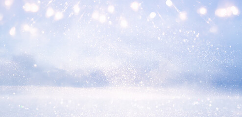 glitter vintage lights background. silver, blue, gold and white. de-focused