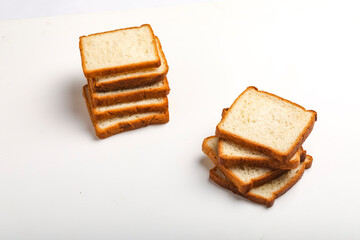Cut of loaf bread on white against white background