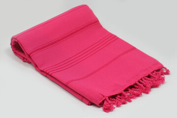 Peshtemal Turkish bath cotton towel folded textile. Beautiful bright colors with natural light background. Perfect online market digital shop sales.