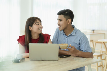 Obraz premium Happy asian couple living at home together.
