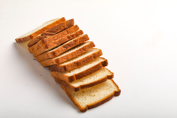 Cut of loaf bread on white against white background