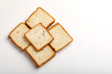 Cut of loaf bread on white against white background