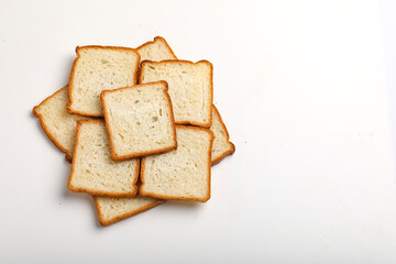 Cut of loaf bread on white against white background