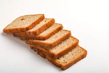 Cut of loaf bread on white against white background