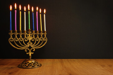 Religion image of jewish holiday Hanukkah background with menorah (traditional candelabra) and candles