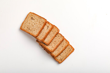 Cut of loaf bread on white against white background