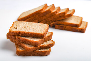 Cut of loaf bread on white against white background