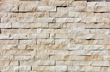 The wall is lined with stone with a chopped side of yellow sandstone.