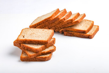 Cut of loaf bread on white against white background