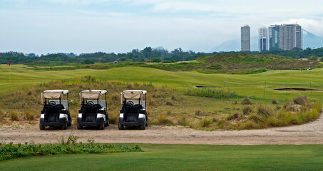 Fototapeta premium Parked golf carts on golf course in Barra da Tijuca, Rio, Brazil