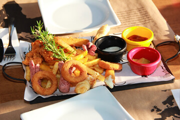dinner of fried French fries with garnish on a decorative plate